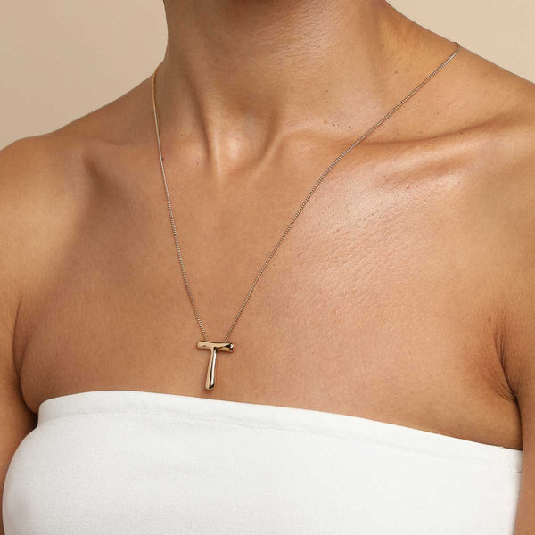 Astrid & Miyu T Initial Bold Pendant Necklace In Gold