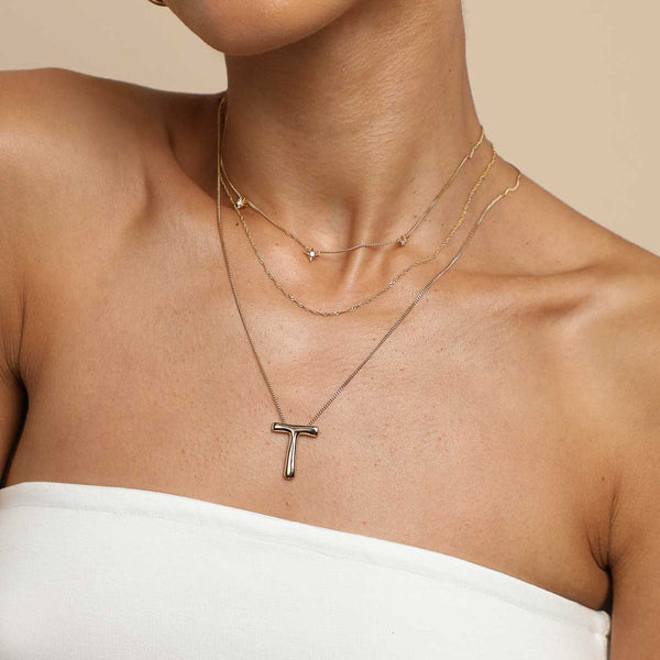 Astrid & Miyu T Initial Bold Pendant Necklace In Gold