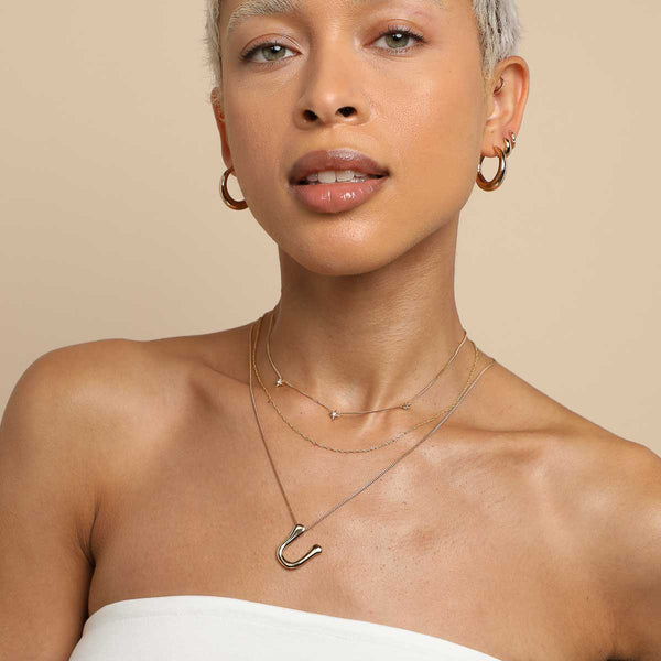 Astrid & Miyu U Initial Bold Pendant Necklace In Gold