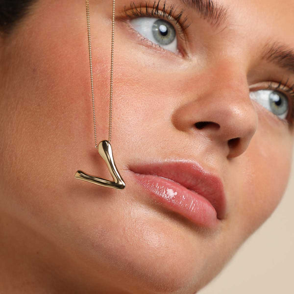 Astrid & Miyu V Initial Bold Pendant Necklace In Gold