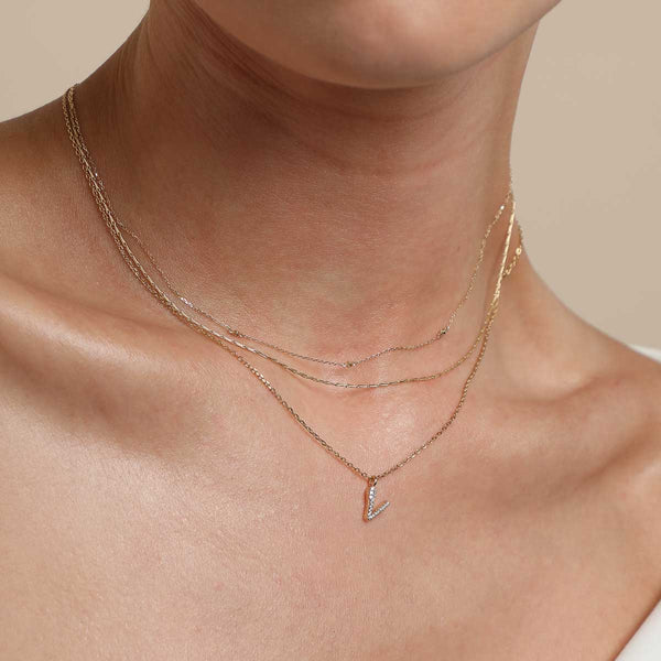 Astrid & Miyu V Initial Pavé Pendant Necklace In Gold