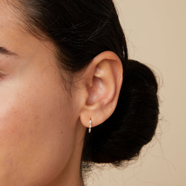 Astrid & Miyu White Topaz Marquise Huggies In Solid Gold