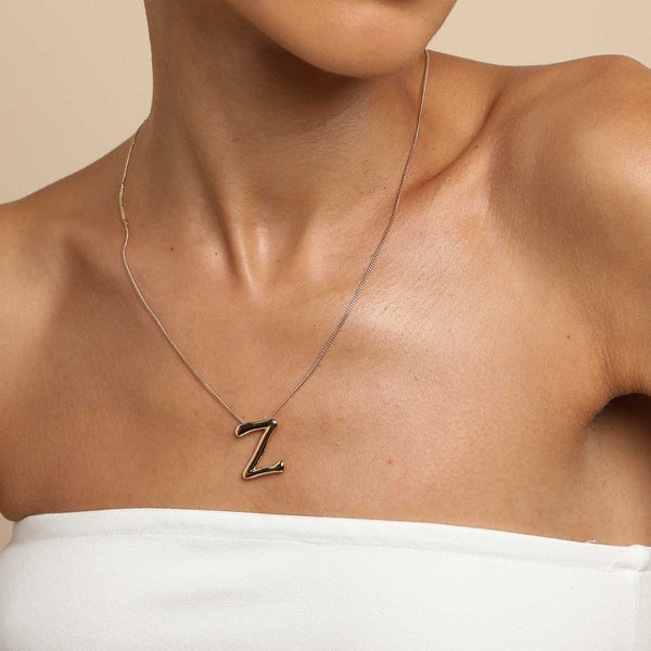 Astrid & Miyu Z Initial Bold Pendant Necklace In Gold