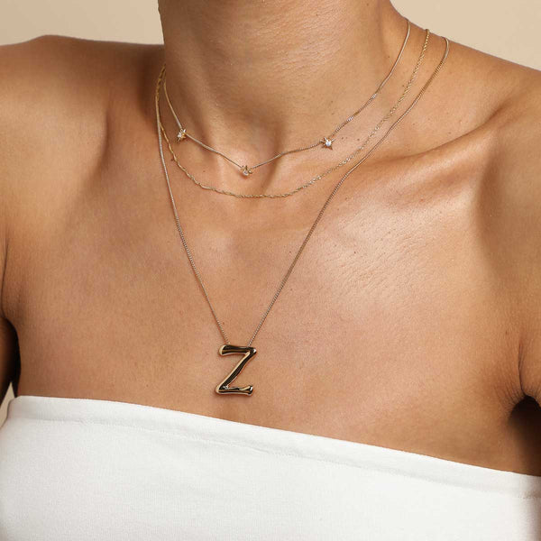 Astrid & Miyu Z Initial Bold Pendant Necklace In Gold