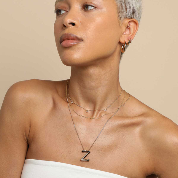 Astrid & Miyu Z Initial Bold Pendant Necklace In Gold