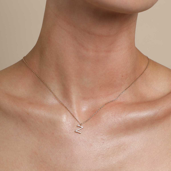 Astrid & Miyu Z Initial Pavé Pendant Necklace In Gold