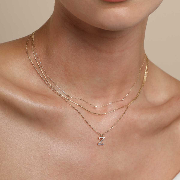 Astrid & Miyu Z Initial Pavé Pendant Necklace In Gold