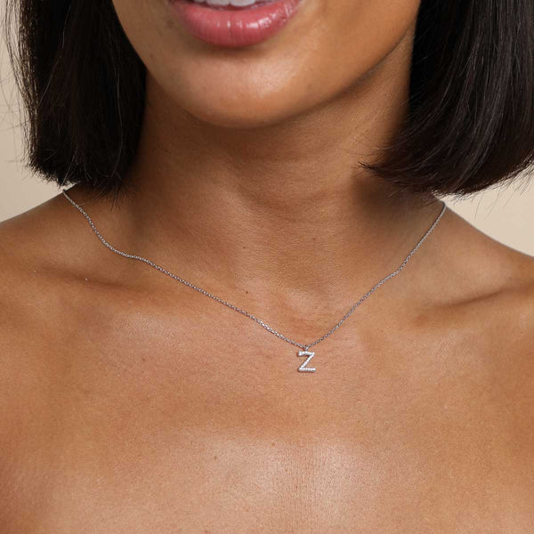 Astrid & Miyu Z Initial Pavé Pendant Necklace In Silver