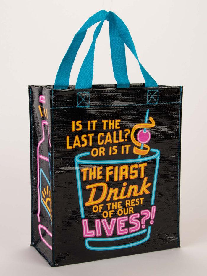 blue q Is It The Last Call Or The First Drink Of The Rest Of Our Lives Handy Tote