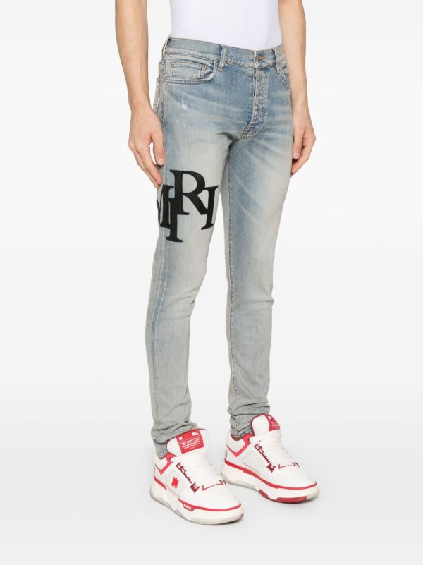 Browns AMIRI Staggered-Logo Jeans | Browns Skinny Jeans