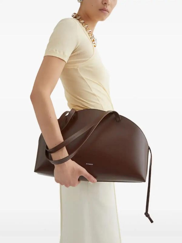 Browns Jil Sander Medium Curved Shoulder Bag | Browns Shoulder Bags