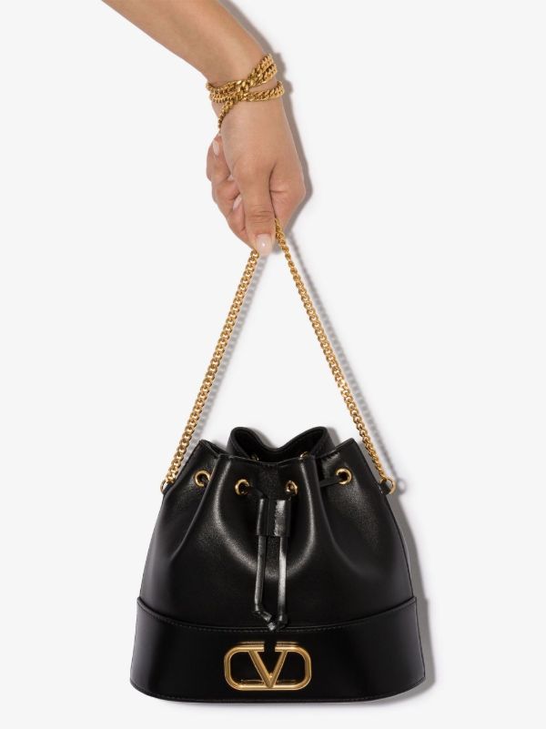 browns Valentino Garavani Black VLOGO mini leather bucket bag | Browns Bucket Bags