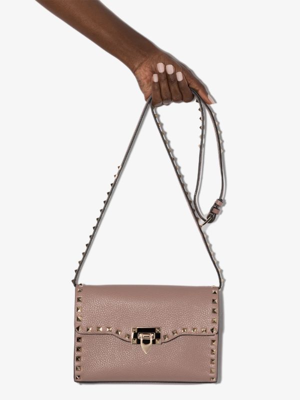 browns Valentino Garavani pink Rockstud leather cross body bag | Browns Messenger & Crossbody Bags