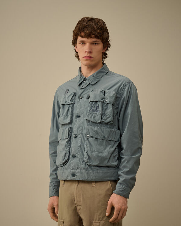 C.p. Company 50 Fili Stretch Short Multi-Pocket Jacket STORMY WEATHER - BLUE