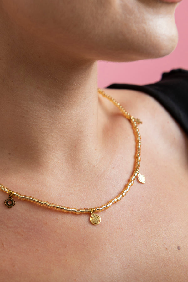 Carisma Gini's Gold Beaded Necklace