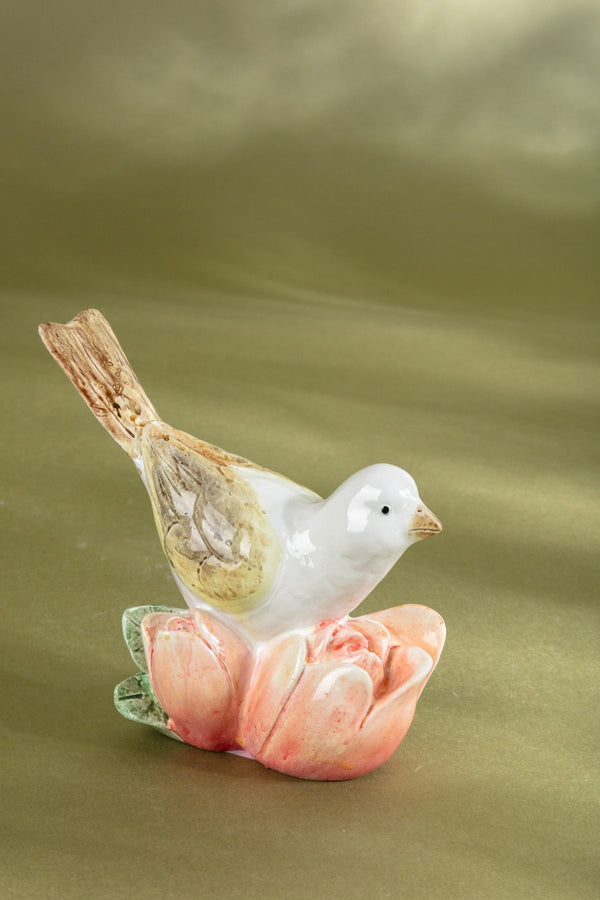 Carraig Donn Bird Resting On A Pink Flower Ornament