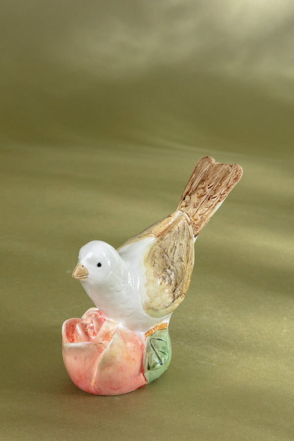 Carraig Donn Bird Resting On A Pink Flower Ornament
