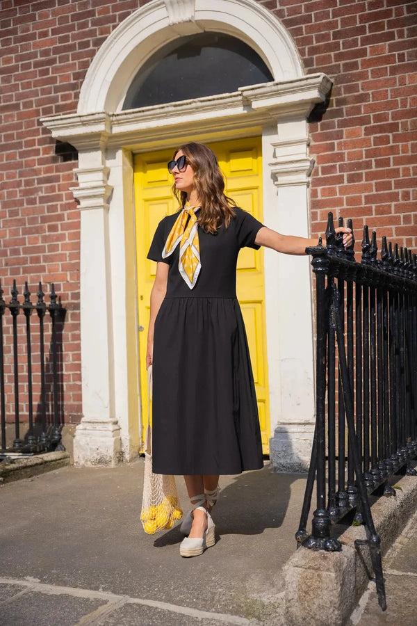 Carraig Donn Black Dress With Short Sleeves And Contrast Fabric Skirt