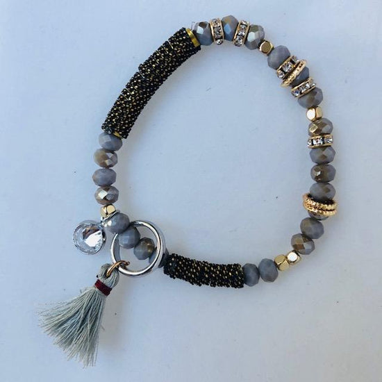 classic collection Grey crystal bracelet with rose gold diamante and grey tassels and charms