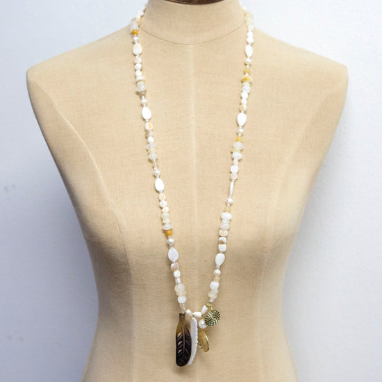 classic collection Natural tones long necklace with crystal pearl and gold and feather charms