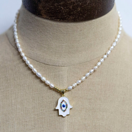 classic collection Pearl necklace with white and gold hand charm