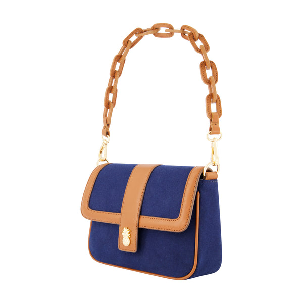 Concept One Tommy Bahama Solid Canvas Flap With Double Leather Stap. Navy/Tan