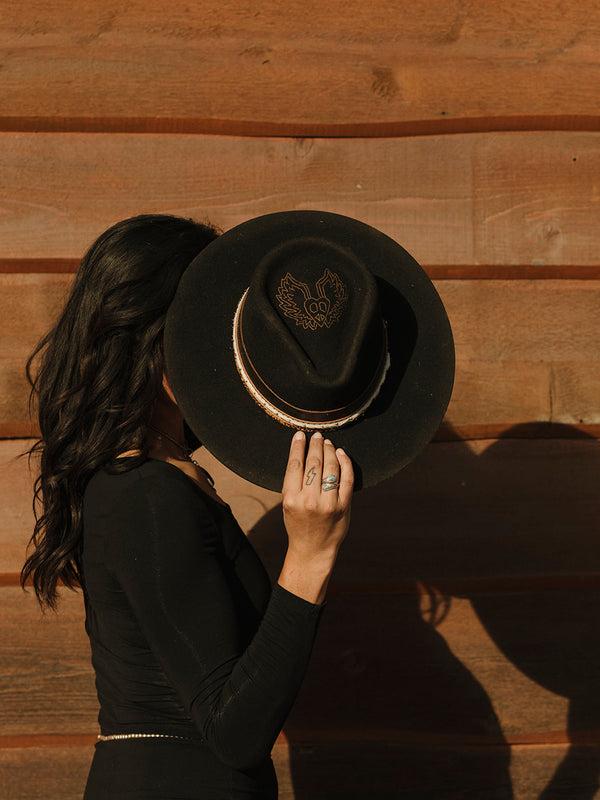 Corral Boots H0003 - DISTRESSED BLACK HEART AND WINGS ON CROWN COWGIRL HAT WITH BROWN LEATHER CROSSPIECE AND PYTHON PRINT HATBAND