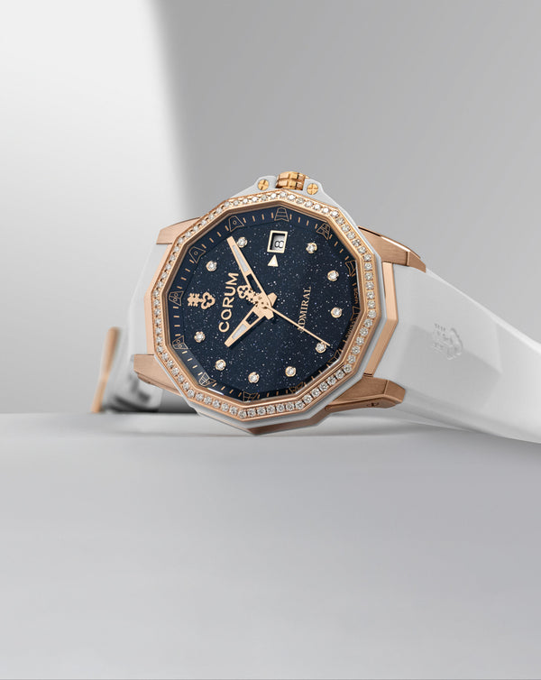 Cortina Corum Admiral 38 Automatic Dark Blue Adventurine Dial With 10 Diamonds 18K Rose Gold Case 72 Round Diamonds On Bezel White Rubber Strap 18K Rose Gold Triple Folding Clasp