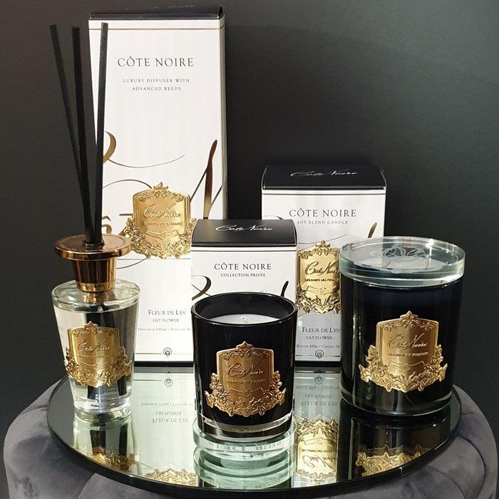 Côte Noire Cote Noire Candle - Dark Vessel With Gold Badge - Lily Flower