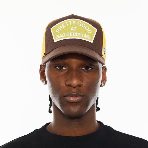 Cult Of Individuality Cult's Logo Mesh Back Trucker Hat "Good At Bad Decisions" In Chocolate Hats
