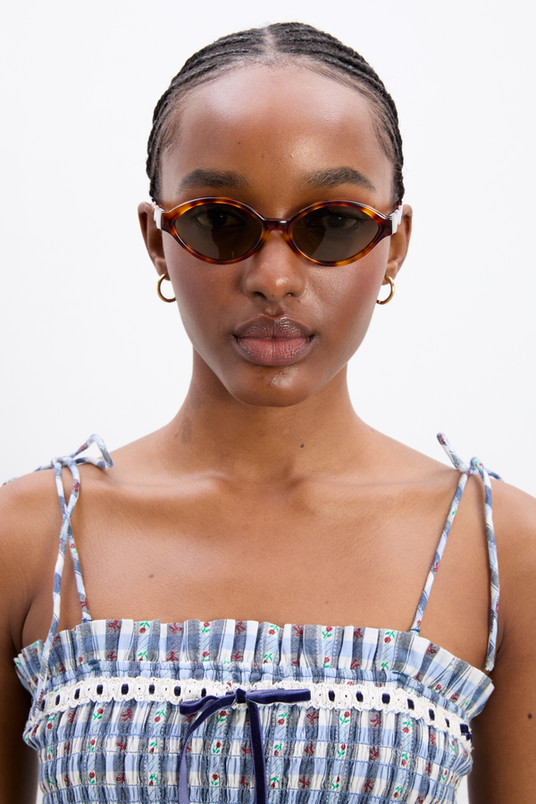 Damson Madder Slim Oval Sunglasses With Wavy Temple In Tort