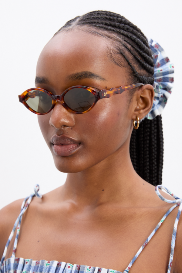 damson madder slim oval sunglasses with wavy temple in tort