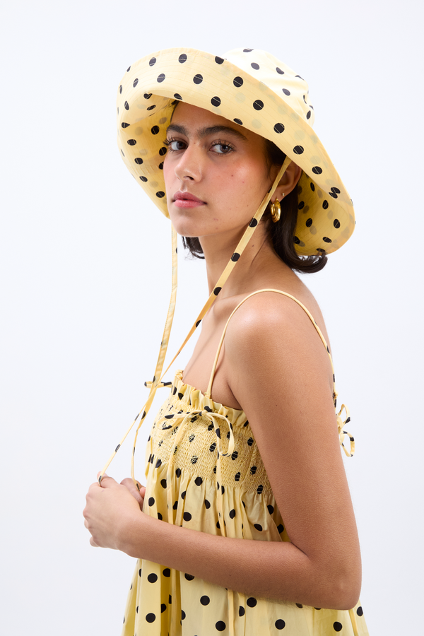 damson madder sunhat in butter yellow & black polka dot