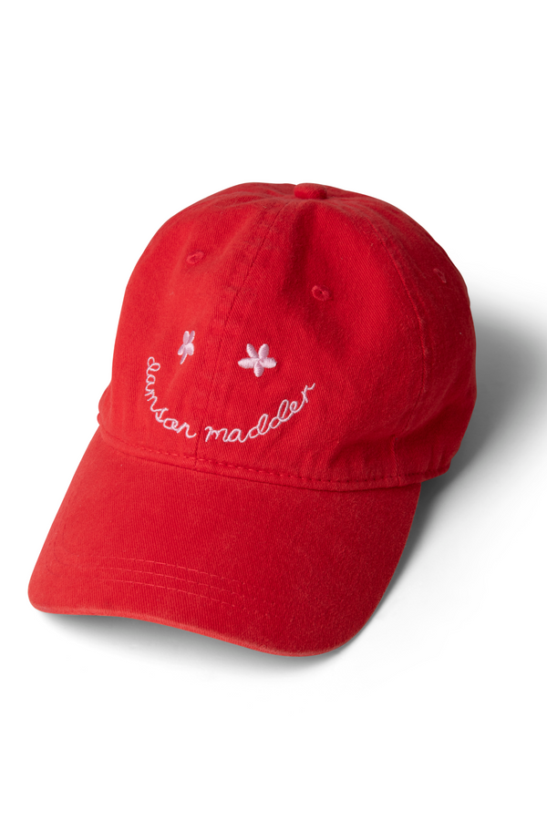 damson madder washed smiley cap in red with pink embroidery