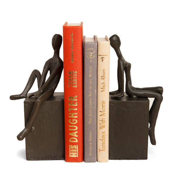Danya B Bookend Set With Man And Woman Sitting On A Block