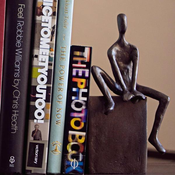 Danya B Bookend Set With Man And Woman Sitting On A Block