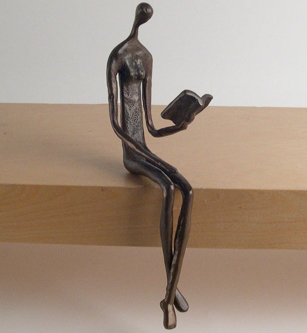 danya b Woman Reading Over Ledge Cast Bronze