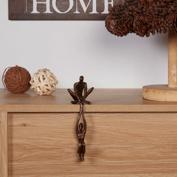 danya b Man Lifting Woman from Ledge Bronze Sculpture