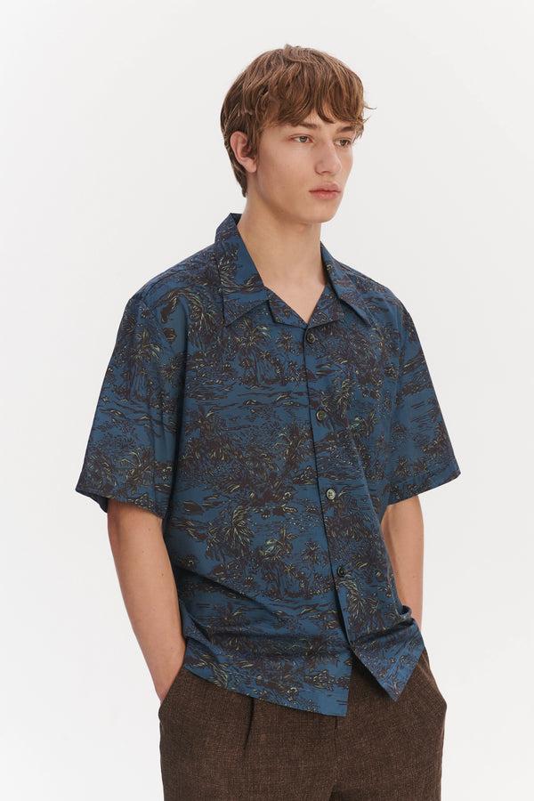 Delikatessen Short Sleeve Cuban Collar Shirt In A Blue Printed Palm Design Italian Cotton And Lyocell