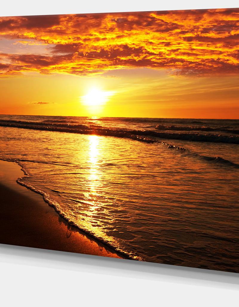 Designq Bright Yellow Sunset Over Waves - Modern Beach Canvas Art Print