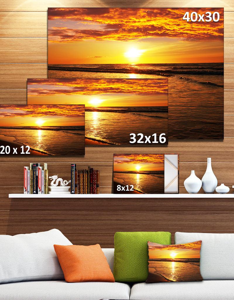 Designq Bright Yellow Sunset Over Waves - Modern Beach Canvas Art Print