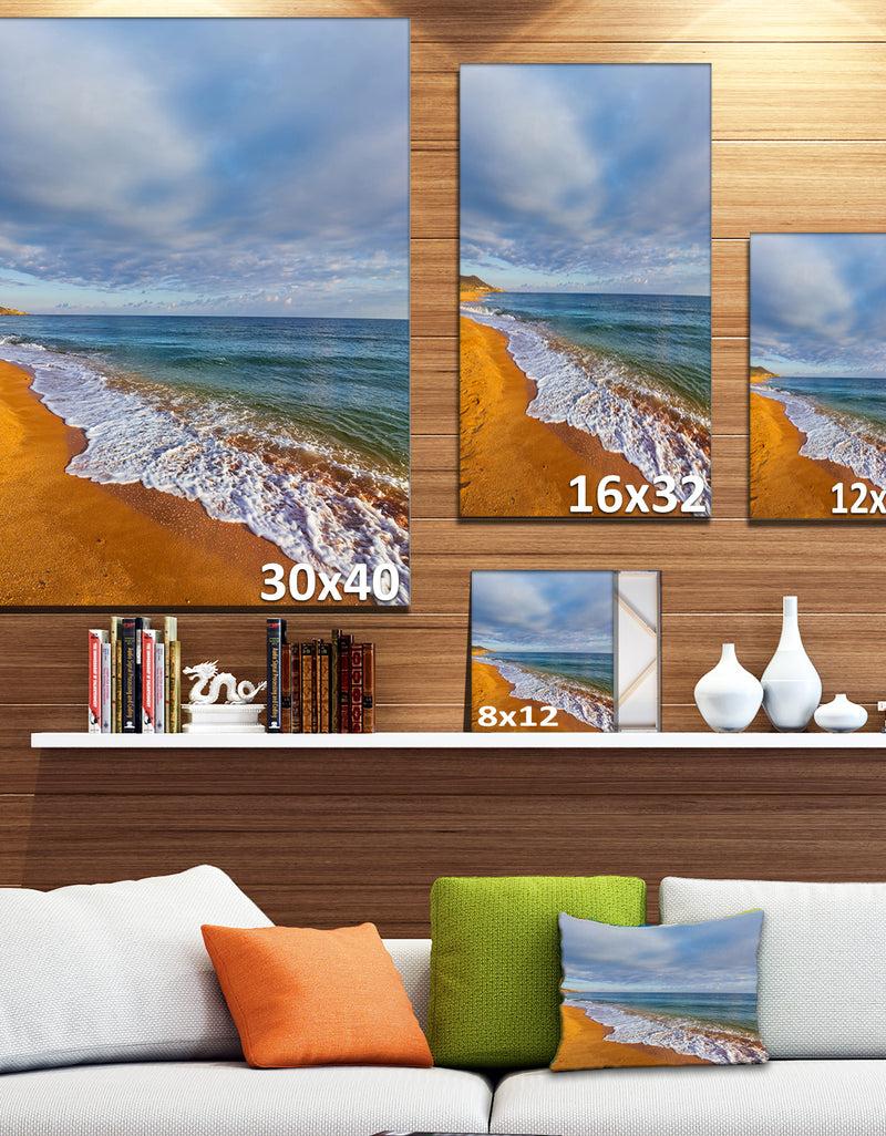 Designq Dark Beach Under Cloudy Skies - Modern Beach Canvas Art Print