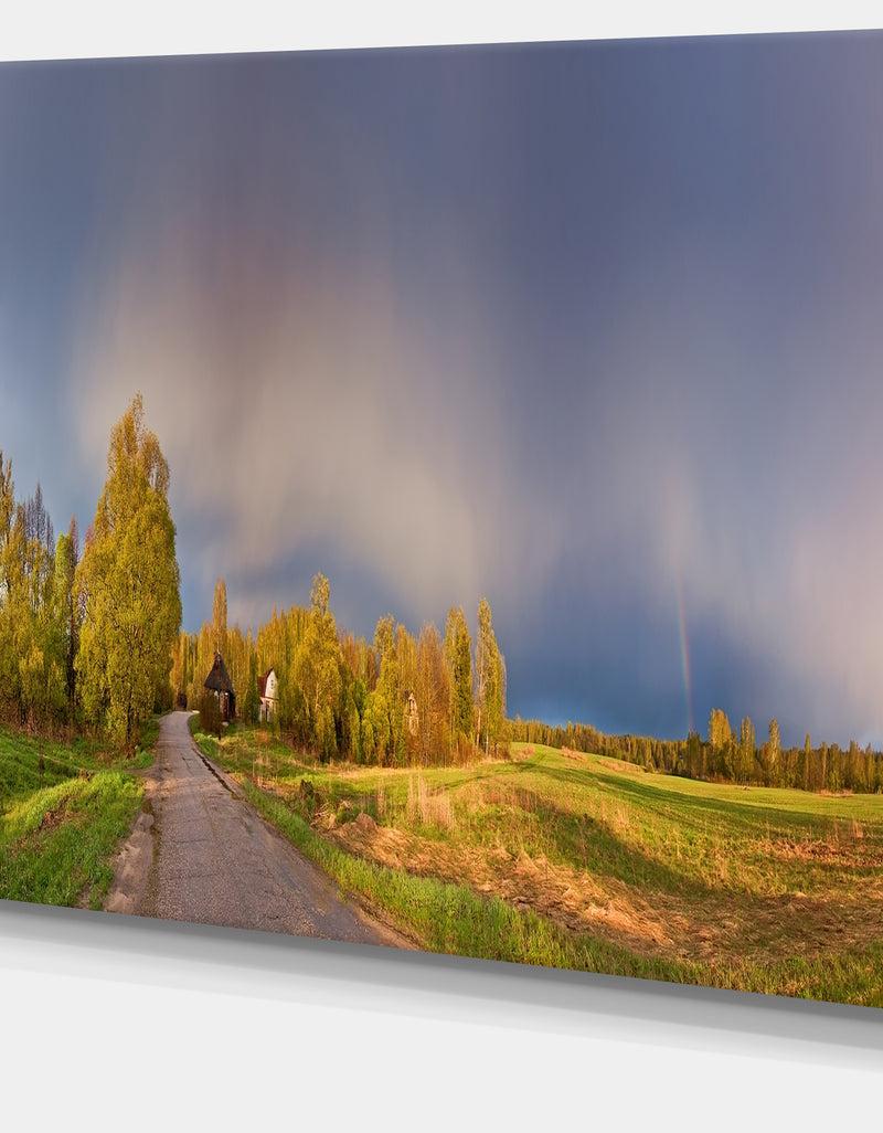 Designq Green Field Under Rainbow Sky - Landscape Photo Canvas Print