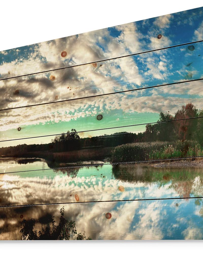 Designq Sky Clouds Mirrored In River Panorama - Landscape Print On Natural Pine Wood