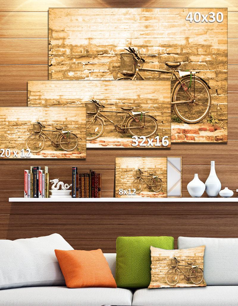 Designq Vintage Bicycle Against Brown Wall - Landscape Canvas Print