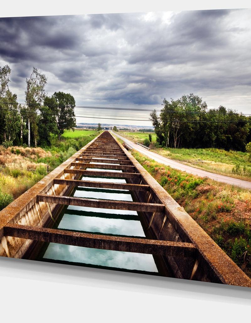 Designq Water Channel And Trees - Landscape Photo Canvas Art Print