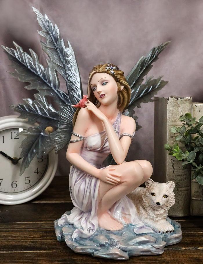ebros gift Blue Frozen Ice Fairy with Frost Flake Wings Crouching by Snow Wolf Pup Figurine