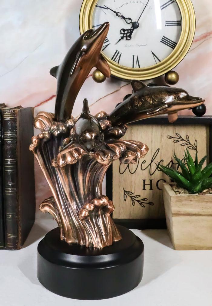 ebros gift Bronze Electroplated Three Bottlenose Dolphins Riding Over Ocean Waves Statue