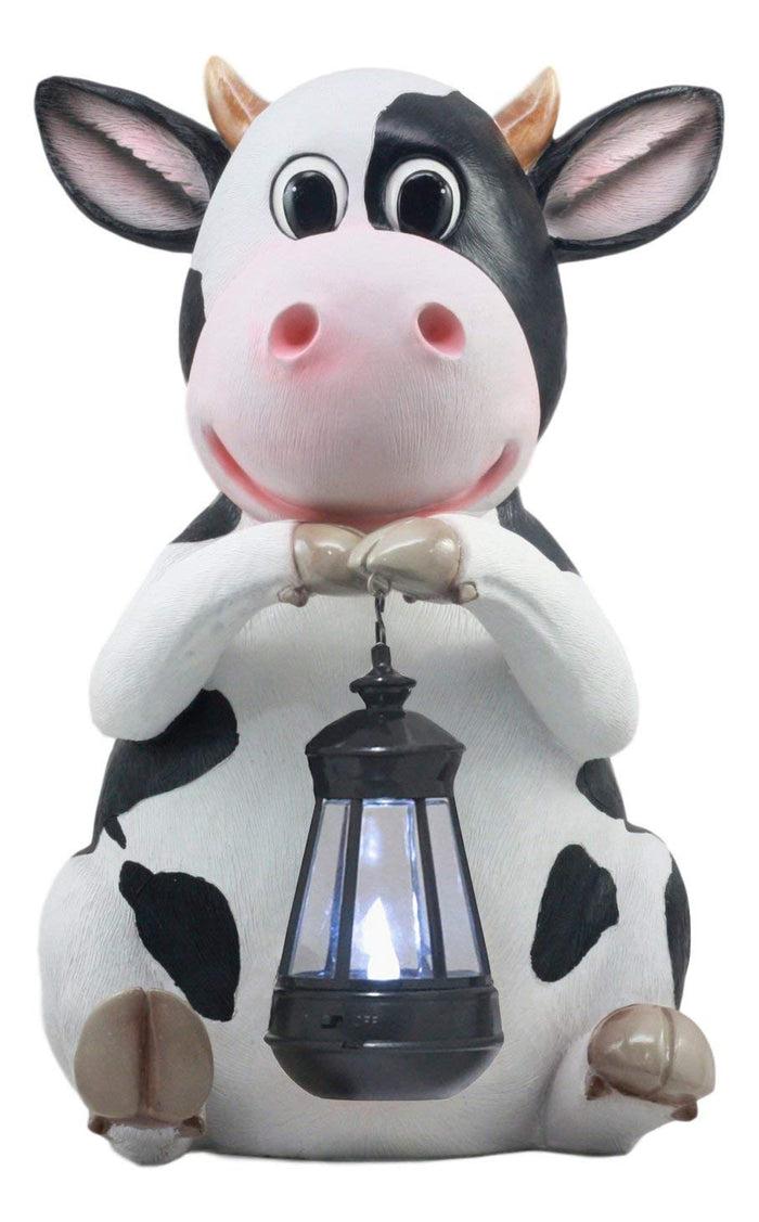 Ebros Gift Ebros Country Farm Whimsical Holstein Cow Statue Holding Solar LED Lantern Light 14"H
