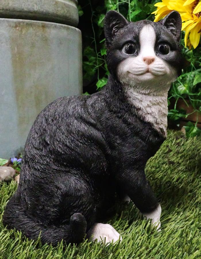 ebros gift Ebros Lifelike Sitting Tuxedo Black and White Cat with Paw Up Statue 10.25" Tall Realistic Glass Eyes Hand Painted Feline Cats Kittens Kitties Animal Pet Sculpture Decor Figurine